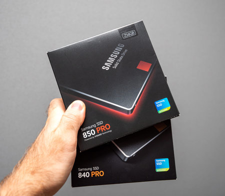Paris, France - May 18, 2019: man hand holding cardboard box of new SSD Solid state drive disk from...
