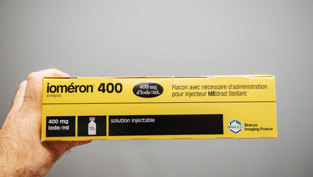 Paris, France - Jun 4, 2019: Male doctor hand holding Iomeron 400 manufactured by Bracco Imaging...