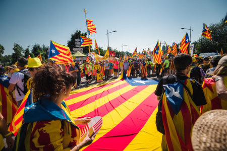 Strasbourg, France - Jul 2 2019: People near huge Estelada Catalan separatist flag on asphalt...