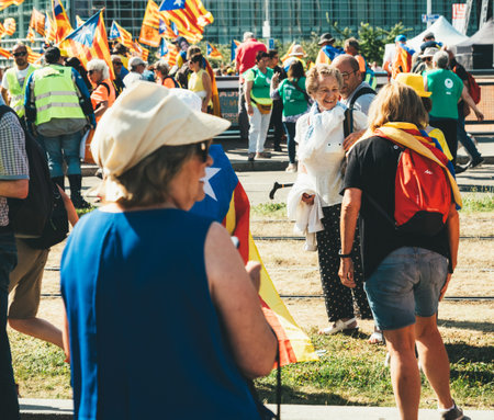 Strasbourg, France - Jul 2 2019: Adults and seniors holding Estelada Catalan separatist flags...