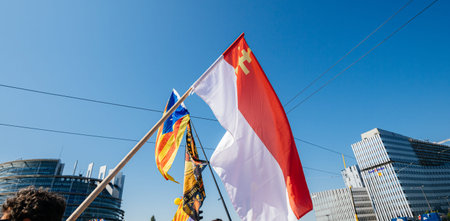 Strasbourg, France - Jul 2 2019: Alsatian and Estelada Catalan separatist flags demonstrate protest...