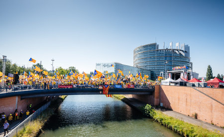 Strasbourg, France - Jul 2 2019: People holding Estelada Catalan separatist flags demonstrating on...