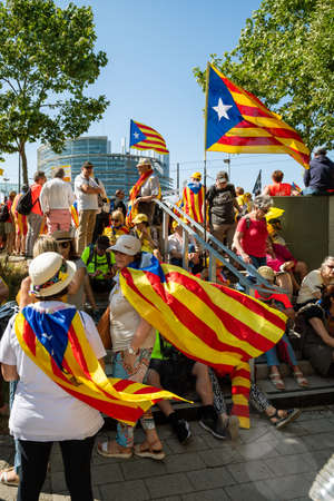 Strasbourg, France - Jul 2 2019: Senior pople resting at the shadow with Estelada Catalan separatist flags at protest front of EU European Parliament against exclusion of three Catalan elected MEPsのeditorial素材