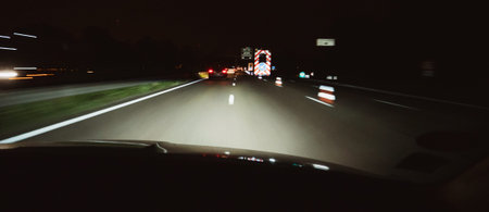 Driver POV at the dark highway with accident roadworks and light flashing arrow - approaching...