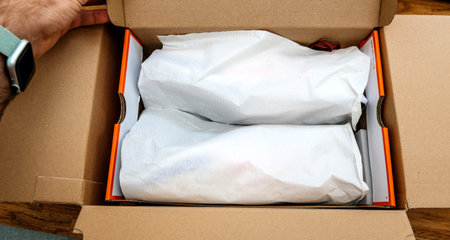 Paris France - Jul 13 2019: Above view unboxing unpacking sport running shoes equipment manufactured...