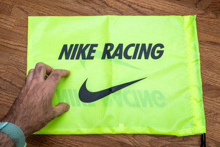 Paris France - Jul 13 2019: Man hand above Nike Racing carriage bag for new running shoes...