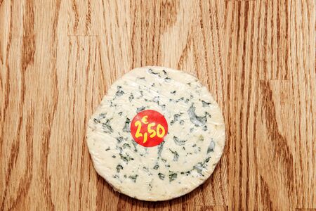 View from above at the fresh and tasty French cheese with price tag 2,5o eurosの写真素材