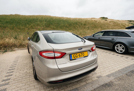 Overveen, Netherlands - Aug 16, 2018: Rear view of new Ford Mondeo Parked on a beach park space in...