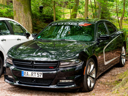 Baden-Baden, Germany - Jul 7, 2019: Side view of new luxury Dodge RT sport American car parked in...