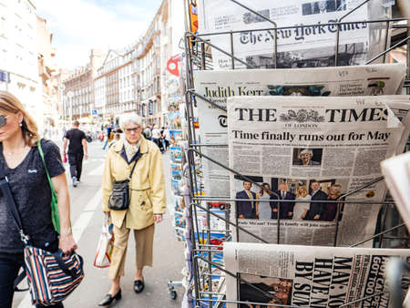 Strasbourg, France - May 24, 2019: Time finally runs out for Theresa May title on The TImes newspaper with pedestrians people walking on French street - brexit news slow motionのeditorial素材