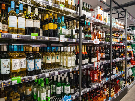 Haarlem, Netherlands - Aug 29, 2019: Large interior of Albert Heijn store with rows alcoholic wine products. AH is the biggest supermarket business in the Netherlandsのeditorial素材