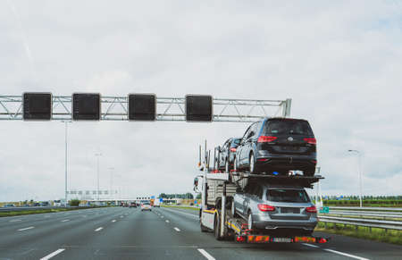 Netherlands - Aug 29, 2019: Cargo truck transporting multiple German cars - Volkswagen and Mercedes-Benzのeditorial素材