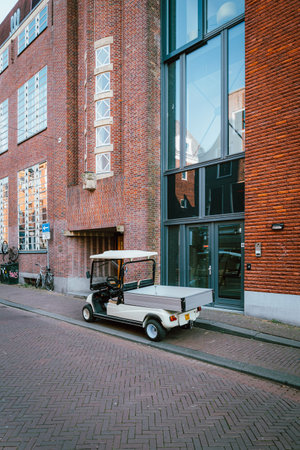 Haarlem, Netherlands - Aug 26, 2019: Public services golf mini truck on the streets of Haarlem near...