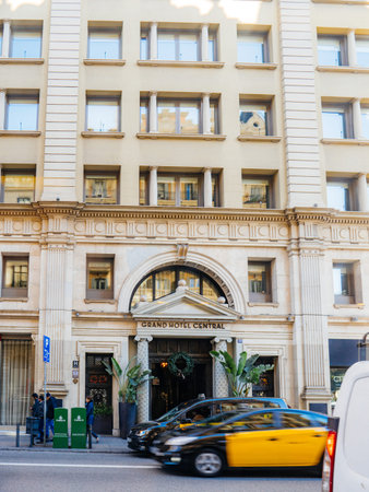 Barcelona, Spain - Bov 15, 2017: Cars and people in front of Grand Hotel Central in Barcelona -...