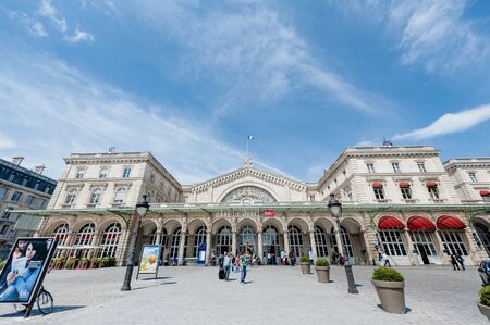 Paris, France - Jul 14, 2011: Wide angle of Parisian Gare de lEst with silhouette of people entering the iconic buildingのeditorial素材