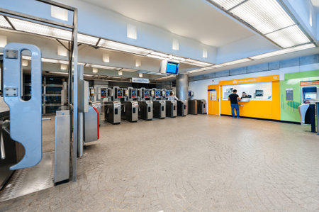 Paris, France - Jul 14, 2011: Empty underground metro station with single man asking information at...