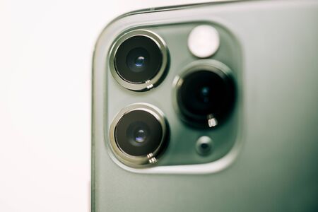 Paris, France - Sep 20, 2019: Detailed close-up macro details of new latest Apple Computers iPhone 11 Pro and 11 Pro Max smartphone triple-lens camera and new technology - Midnight green colorのeditorial素材