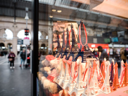Paris, France - Jan 20, 2019: Multiple decorative Eiffel Tower statues in the showcase window of...