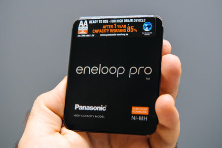 Paris, France - Sep 13, 2019: Man hand holding Panasonic Eneloop Pro High capacity modern Ni-MH...