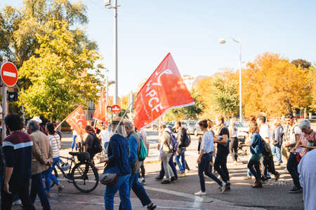 Strasbourg, France - Sep 21, 2019: man with PCF French communist party flag at largest worldwide climate march change started by Swedish climate activist Greta Thunbergのeditorial素材