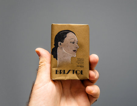 Paris, France - Oct 5, 2019: Man hand holding Portuguese Soap bar with vintage packaging - sabonete...