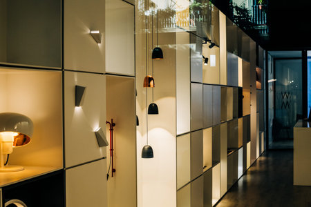 Luxury modern interior of office with multiple wardrobes and diverse types of lamps