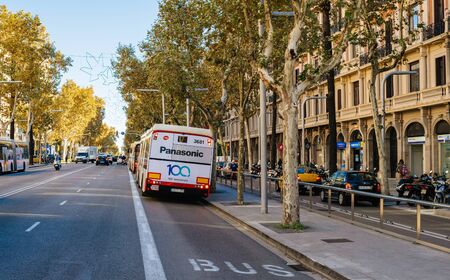 Barcelona, Spain - Nov 2017: Busy Avinguda Diagonal avenue with cars and dedicated bus line with advertising to Panasonic 100th anniversaryのeditorial素材