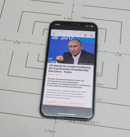 Paris, France - Nov 11, 2017: Latest Apple Computers iPhone 11 Pro featuring Sputnik News app with Vladimir Putin Russian Federation presidentのeditorial素材