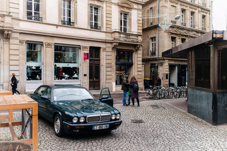 Strasbourg, France - Dec 27, 2017: Vintage Jaguar luxury red limousine parked on a French street...