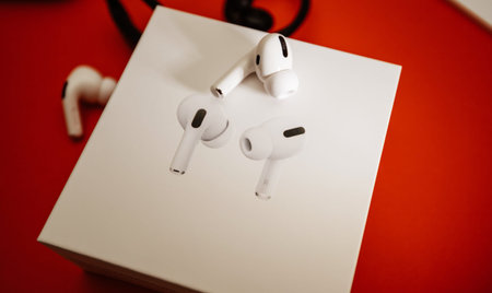 Paris, France - Oct 30, 2019: One Apple Computers AirPods Pro headphones with Active Noise...