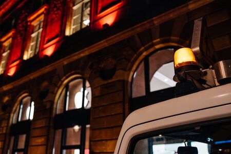 Strasbourg, France - Nov 23, 2017: Low angle view of siren on the emergency truck van rooftop with Apple Store logotype on Aubette building Place Kleberのeditorial素材