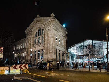 Paris, France - Jan 20, 2019: iconic building of Gare de Nord in central Paris with commuters people walking in winter old and modern glass pavilionのeditorial素材