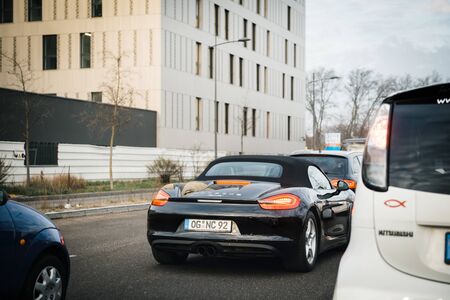 Strasbourg, France - Dec 13, 2016: Rear view of traffic jam with Porsche 911 Boxter waiting near Mitsubishi and other carsのeditorial素材