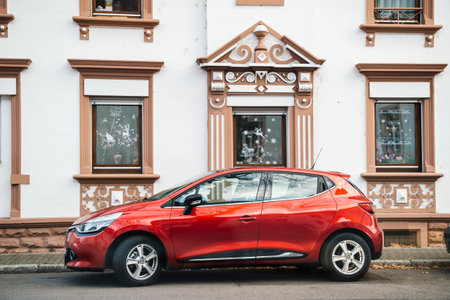 Kehl, Germany - Dec 13, 2016: German city of Kehl with red Renault car parked in front of home...