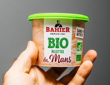 Paris, France - Nov 3, 2019: Man hand holding Bio Rillettes du Mans Bio organic manufactured by...