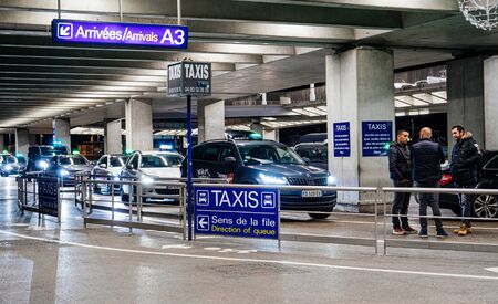 Nice, France - Nov 24, 2019: Row of cars taxis and their drivers waiting outside Nice Cote dAzur international Airport for passengersのeditorial素材