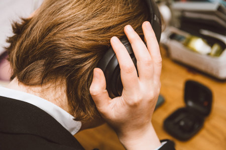 Paris, France - Oct 30, 2019: Overhead view of woman hands testing Beats Pro with Active Noise Cancellation for immersive soundのeditorial素材