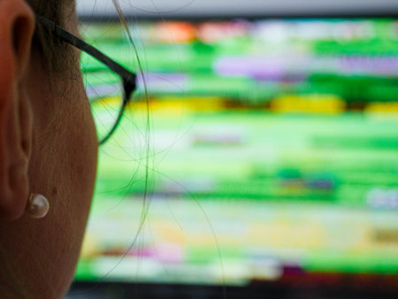 POV woman wearing eyewear looking at the bad signal transmission noise effect on the CRT LCD display...