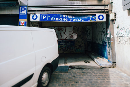 Paris, France - Mar 19, 2019: White van near damaged parking entrance a few meters from Champs...