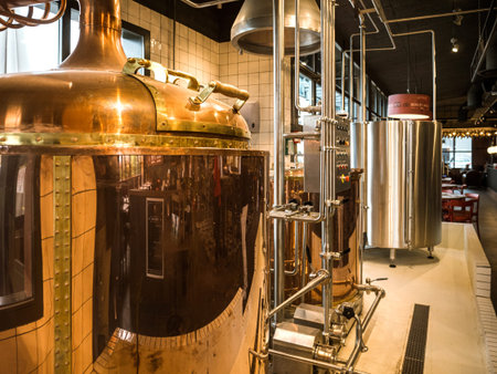 Strasbourg, France - Oct 7, 2019: Perspective view of beer brewery with multiple tubes, pipes and...