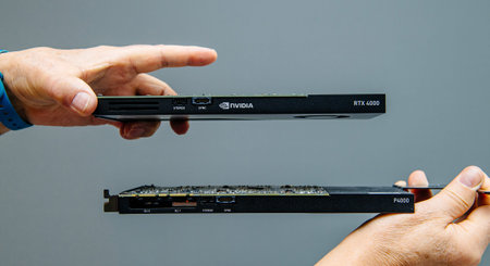 Paris, France - Mar 28, 2019: Man hands comparing latest Nvidia Quadro professional GPU video card...