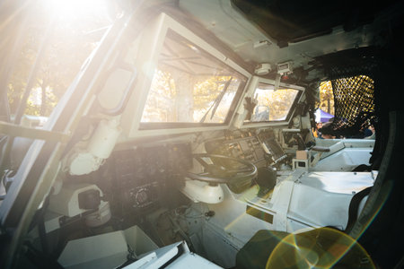 Strasbourg, France - Sep 21, 2019: Sunlight flare over Empty drivers seat of French Army Petit...