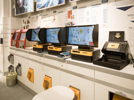 Kehl, Germany - Oct 6, 2017: Row of Multiple digital photo printing devices Kodak Picture Kiosk...