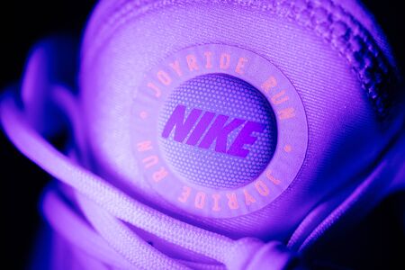 Paris, France - Jul 30, 2019: Close-up of NIke Joyride logotype on the front of latest innovation the Joyride running shoes with thousands of tiny beads for better support - neon modern colorsのeditorial素材
