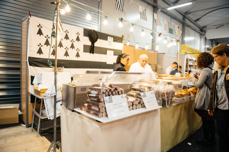 Strasbourg, France - Feb 16, 2020: Andouille Apero Bretagne sweets visitors people at French wine at...