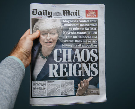 Paris, France - Mar 15, 2019: Male hand POV at the latest edition Daily Mail newspaper featuring...