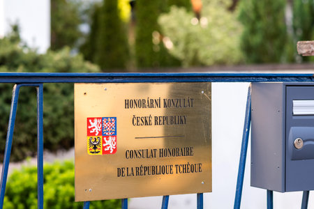Honorary consulate of Czech Republic in two languages on the main entrance of the diplomatic mission - including Czech coat of armsの写真素材