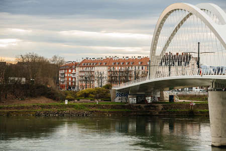 Strasbourg, France - Mar 17, 2020: New Tramway bridge between Strasbourg and Kehl with multiple apartments building in background - Rhine riverのeditorial素材