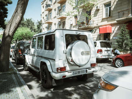 Baku, Azerbaijan - May 2, 2019: Luxury Mercedes-Benz AMG G63 parked near soviet building in central Bakuのeditorial素材