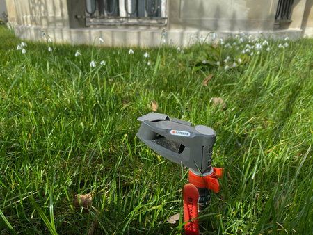 Paris, France - FEb 2, 2020: New Gardena water sprinkler with multiple snowdrops in background green...